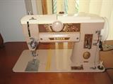 singer sewing machine in cabinet runs good