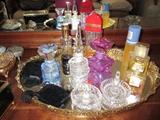 assorted perfume bottles and ring holders
