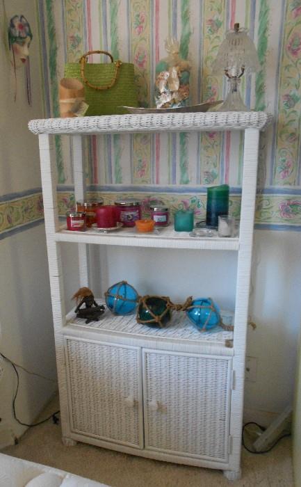 Wicker shelf with cabinet.