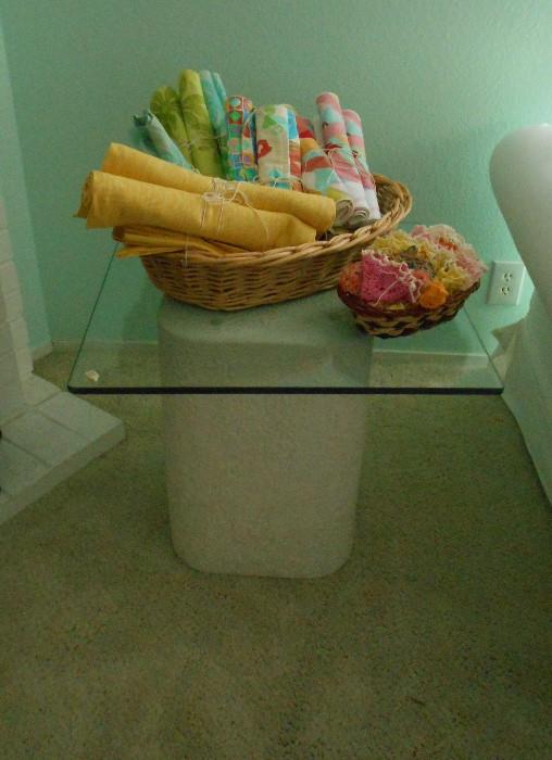 Contemporary matching end table.  Vintage crochet doilies in small basket.  Cloth placemats and napkins in larger basket.