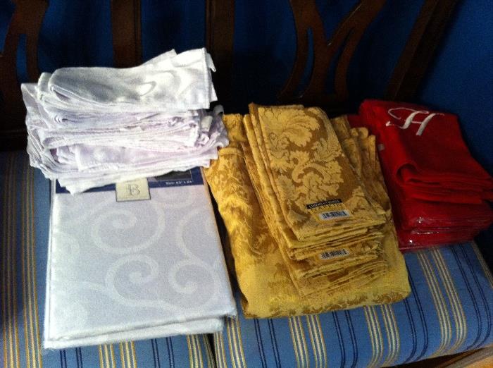 Assorted table linens, some new with tags.