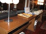 Approx. 10' long oak sofa table with chess sets and (2) - 8 bulb lamps