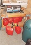 Table saw, gas cans, work bench
