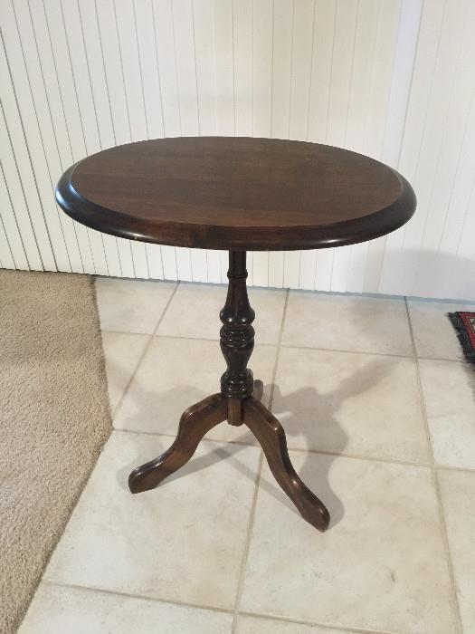 Round wooden pedestal table