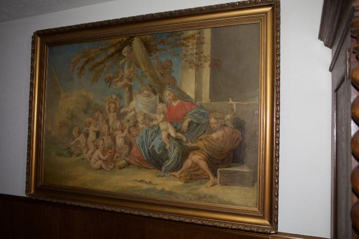 302/333  Painting.  A 19th century continental oil painting on canvas.  An outdoor scene showing St. Mary, seated, holding the infant Jesus, St. John at her side with a group of putti bearing gifts for the Christ child.
Unsigned.
Viewing area:  51" x 33 3/4", giltwood frame.  $2250.00