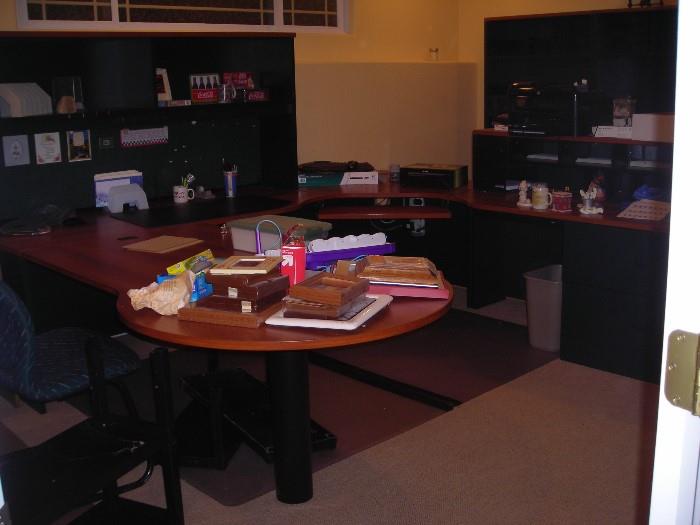 this is a large and very nice office desk.  there is also a lot of office supplies to