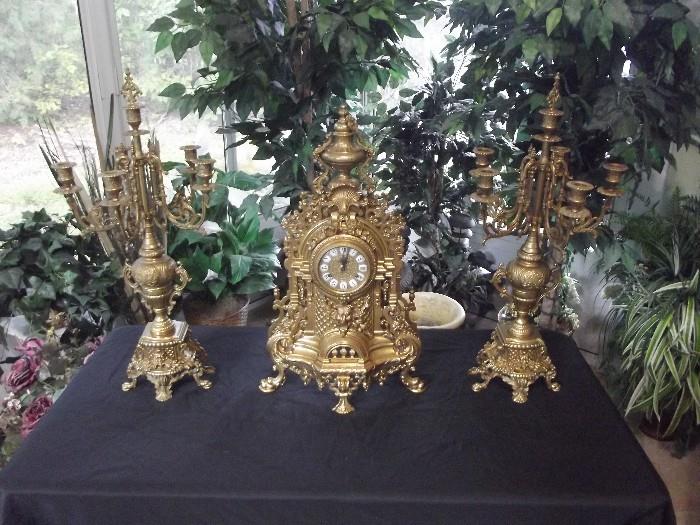Stunning vintage Imperial Clock and matching brass candelabras. Clock is constructed in Italy, clock works made in Germany. Very unique and rare combination of three original pieces.