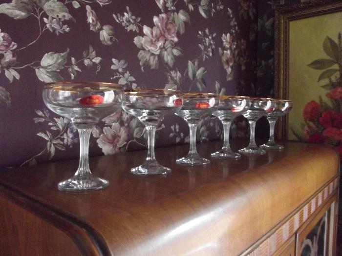 Set of Six 24 Karat Gold-rimmed wine/champagne glasses by Valencia .