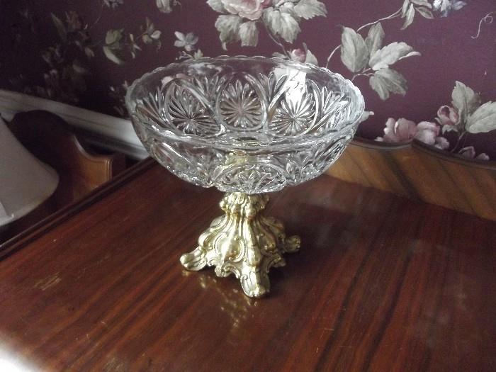 Brass stand with unique glass bowl .