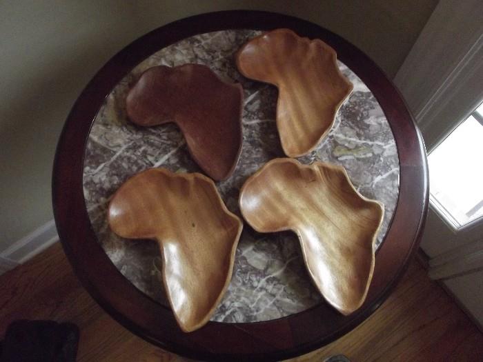Hand carved wooden dishes .