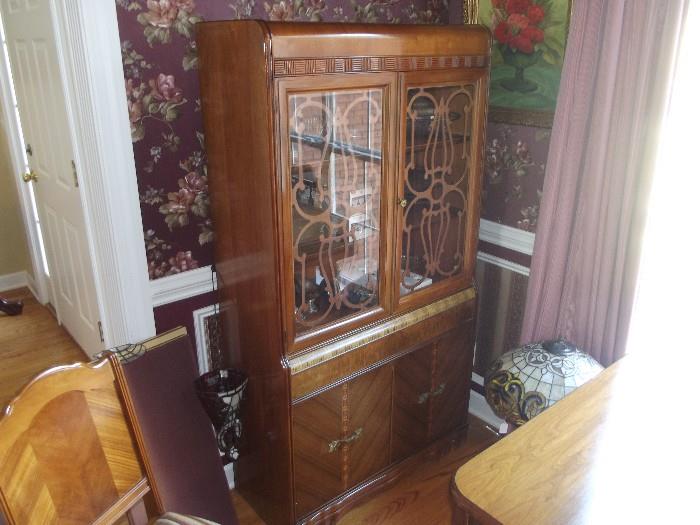 Gorgeous Waterfall design Depression Era China Cabinet, Please come see us to really appreciate the beauty of this dining room show piece. 