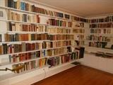 Living Room: A view of just SOME of the many books in this house. Books are in English and German and include fiction, non-fiction, classics. Note: The modern shelving and brackets are also for sale.