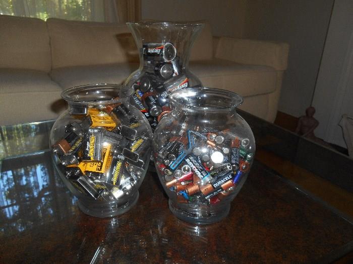 Living Room:  Several jars of used batteries make an interesting display on the contemporary coffee table.