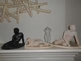 Living Room: A closer view of the many sculptures on the mantel.
