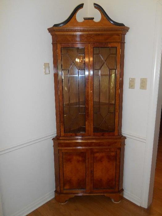Dining Room:  A very handsome corner unit with two glass panel doors and two lower doors.  It measures 7' tall x 33" wide.