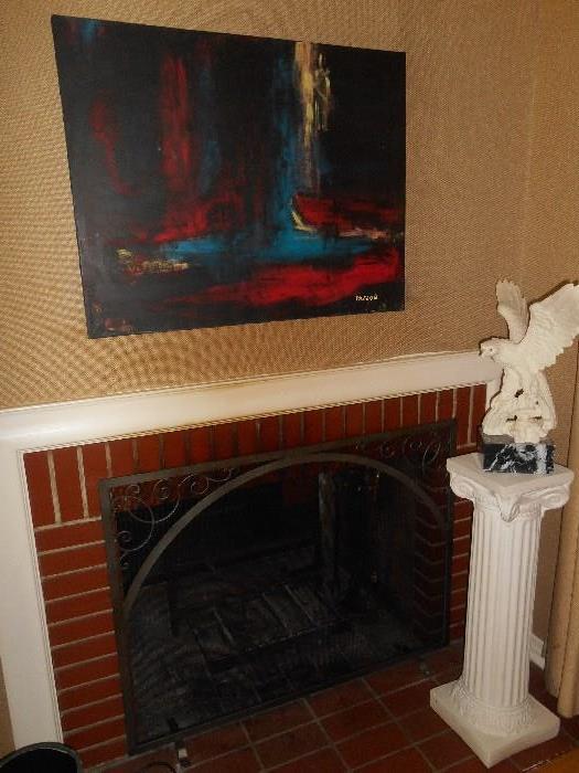 Family Room:  An original piece of modern art by artist "PASSON" is above the iron/mesh fireplace screen which is 44" wide x 34-l/2" tall.  To the right is an eagle on a marble base resting on a 33" tall plaster pedestal.