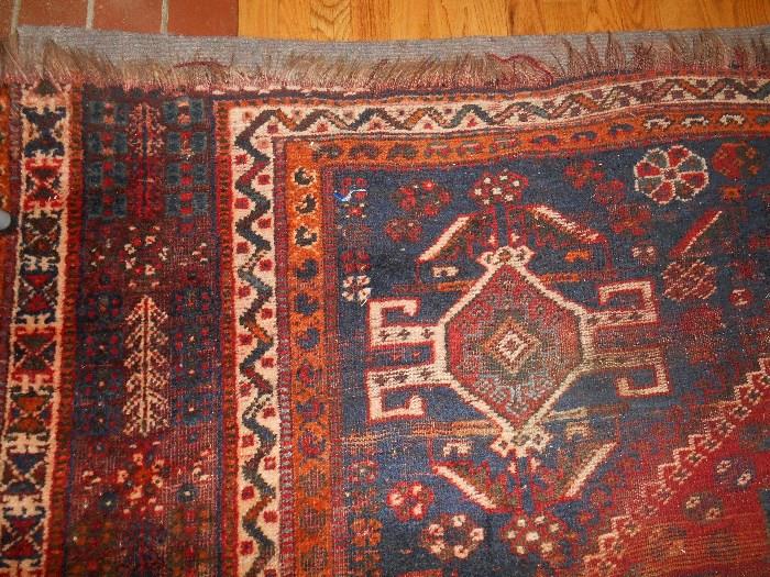 Family Room:  A corner of the antique rug which measures 9' x 7' 6" and is "as is."