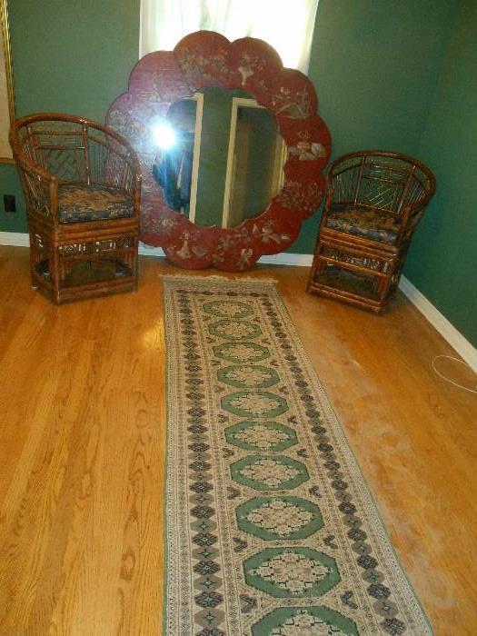 Bedroom #1:  We named this the "Asian Room."  Shown are a green Bokhara [with pad] runner which measures 10' 4" x 2' 7"; a large Asian mirror that is 60" round; and  two rattan chairs which have Asian-theme custom made chair pads.