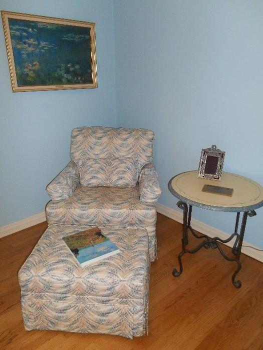 Bedroom #2:  A custom made occasional chair and ottoman by EXPRESSIONS; a blue/cream round table on iron base; a CLAUDE MONET print.