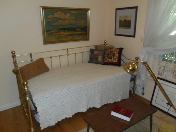 Bedroom #3:  A brass daybed/trundle bed (includes both mattresses); small coffee table; prints.