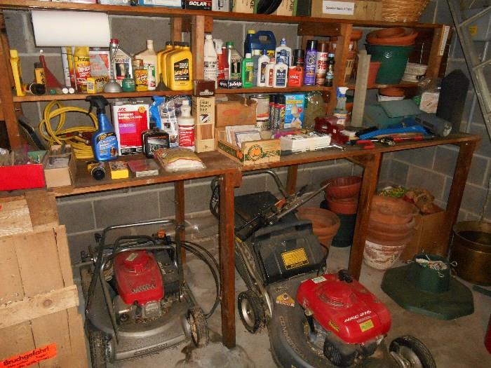 Garage:  Two push/self-propelled mowers:  one HR216 HONDA and one HRC216 HONDA Commercial Hydrostatic (both sold "as is"); planters; baskets; an aluminum extension ladder; two wooden ladders;  lots  of chemicals.