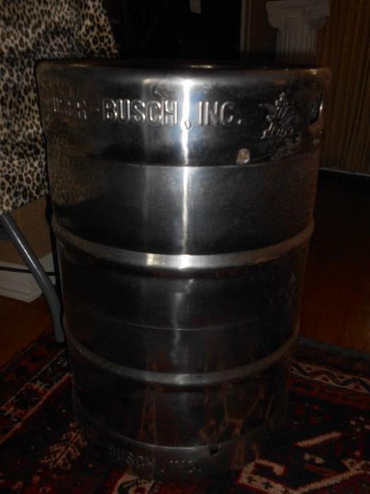 Family Room:  A large silver keg from Anheuser-Busch.  Put a glass top on it for a neat side table!