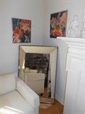 Living Room: A large mirror (48" x 32") was originally purchased at Williams-Sonoma. Two of three floral prints are on the wall.