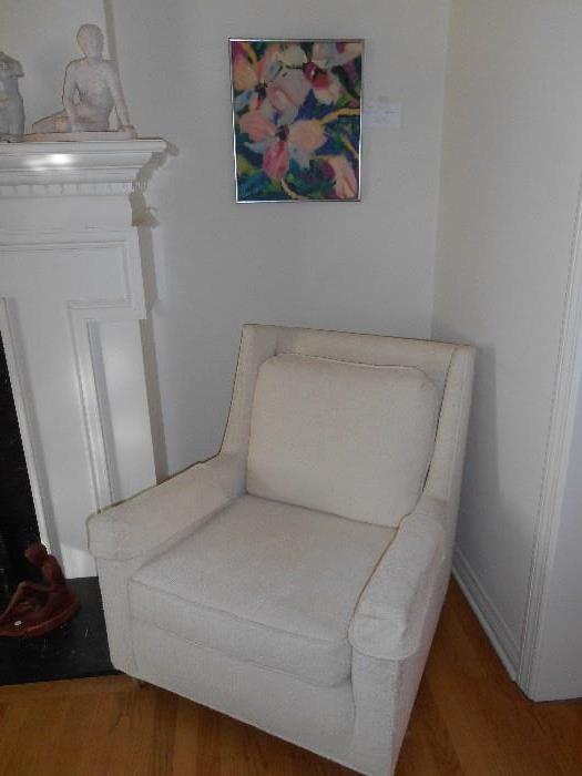 Living Room:  The matching chair to the sectional (priced separately from the sectional) and one of three prints.