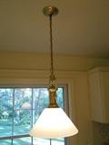 Kitchen: The brass and white glass shade light fixture is for sale. (Arrangements must be made to remove it.)