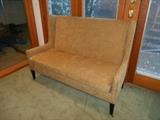 Lower Level: A custom made love seat/sofa from EXPRESSIONS. It is 65" wide with a 44" high back.