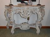Lower Level: A closer view of the painted console which measures 51" wide x 17" deep x 31-l/2" tall. (Note: a similar console is nearby but this one has a carved basket on its stretchers.)