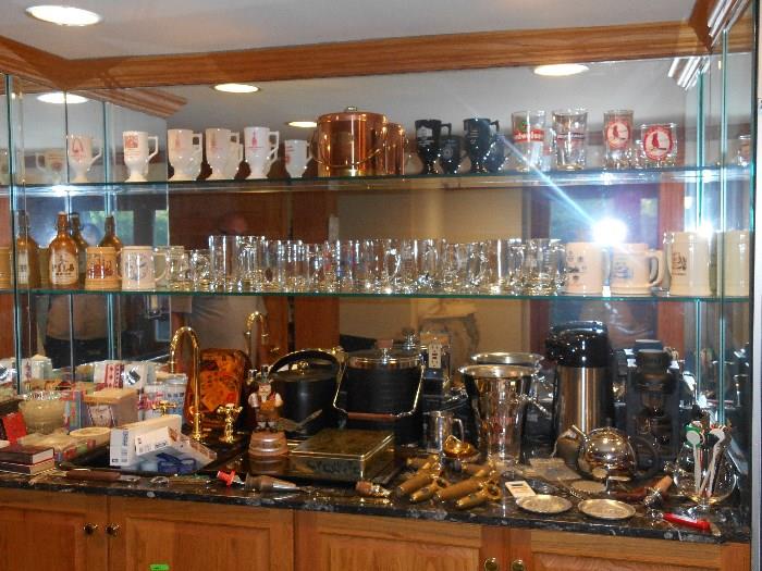 Lower Level:  A view of the bar with lots of glassware and barware.  Included are items from the "National Brewing Association" and the "American Congress of Brewers."