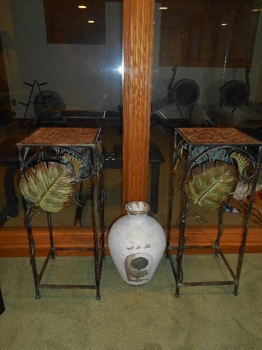 Lower Level:  Two metal leaf/rattan plants stands and a large urn.