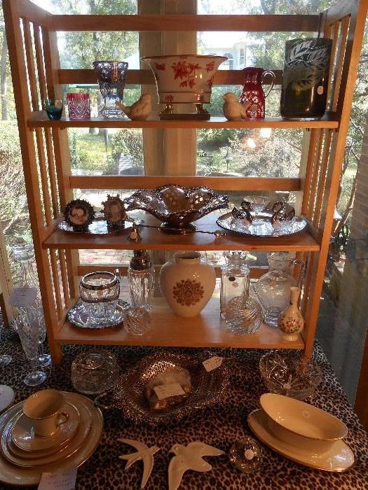 Family Room:  Colored glass; one HEREND porcelain cache pot; silver-plate; and crystal.  Nearby is a WATERFORD decanter, and a few pieces of cut glass.