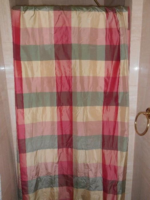 Bedroom #1:  Draped over a shower door is a pair of custom made plaid/lined drapes:  65" wide x 84" long per panel (two panels).  