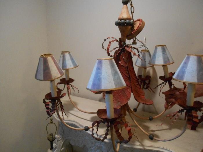 Lower Level:  A fun metal chandelier with lamp shades.