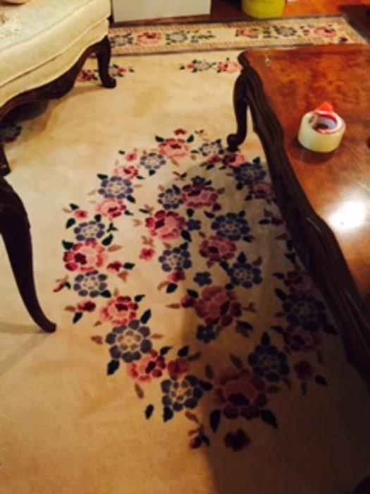 8 x 10 rug with rose, blue, green, against a cream background--excellent condition  (Coffee Table also pictured)
