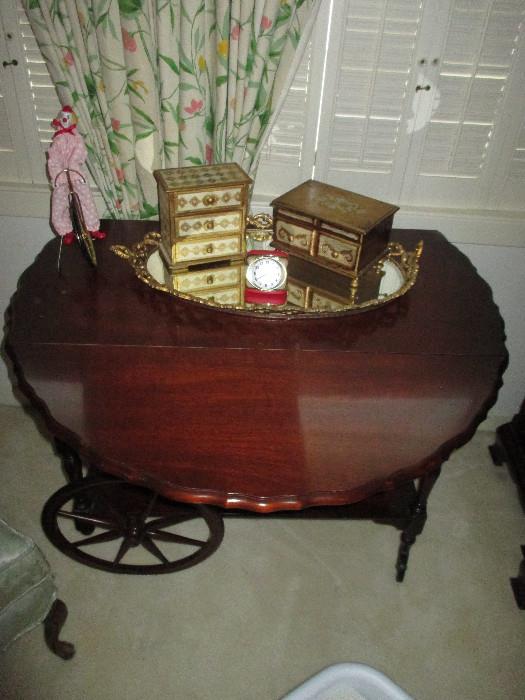 Wagon Wheel Tea Cart That Is Also A Drop Leaf Table.