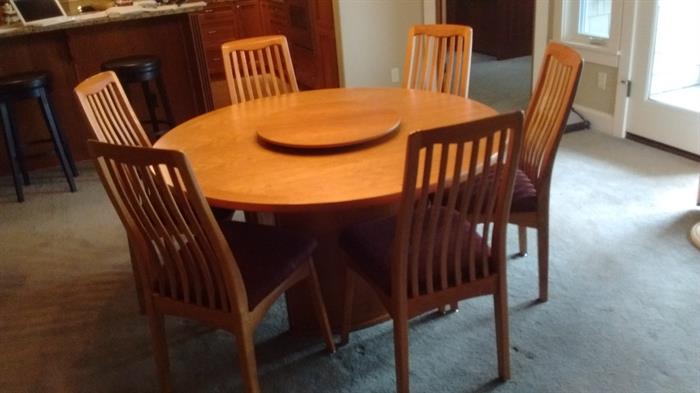 55" Round Dining Table, Solid Cherry.  Six matching Chairs, upholstered, and 22"dia. Lazy Susan (removable),  all Scan Design Furniture.