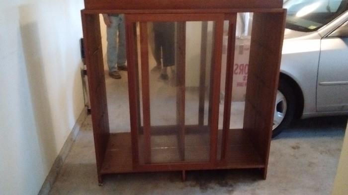 Mid century Teak Danish Display cabinet w/glass shelves (5) and halogen lights at top and mirrored interior.)  (Needs a "cover" at top, as it was modified earlier.)   size 47w x 47h x 12d.