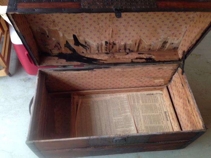 Interior of antique trunk, tray in bottom