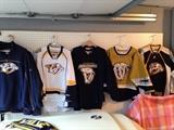 About a dozen Predators jerseys dating back to early days. Navy blue in center has early/first logo. Yellow/mustard color signed by Jordan Tootoo the only year he was #55. Several signed. These retail for about $125 each at the arena. Great chance to get a hold of one for less! Great condition. 