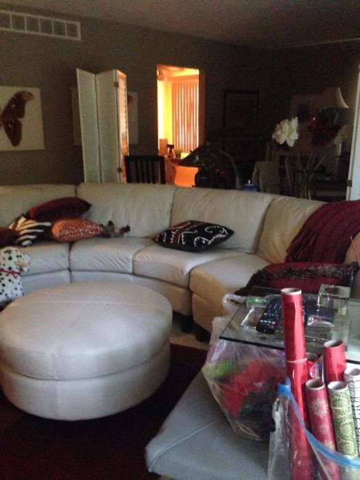 Curved leather sofa (in three pieces!) and ottoman , soft, supple, high quality.  Some scratching but overall beautiful piece. 