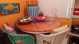 Round pedestal kitchen table.  Wicker chairs.