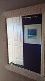 Wicker mirrors, at least 3 in the home.