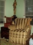 Great chair, end table and statue.