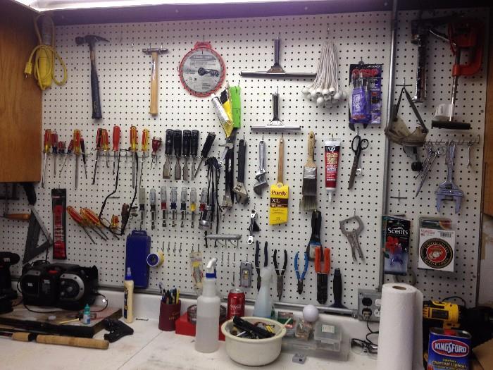 Well-organized tool shop. Lots of Craftsman brand tools & power tools