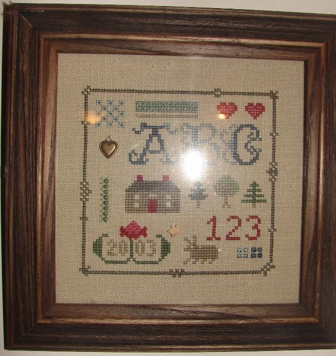 Small framed embroidered sampler