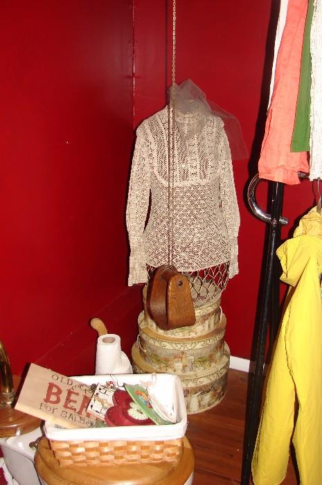 Vintage blouse, metal dressform torso, hat boxes and a basket of wall hangings