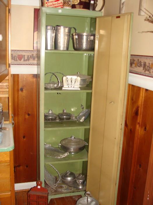 Metal Kitchen Cabinet filled with Vintage Hammered Aluminum items